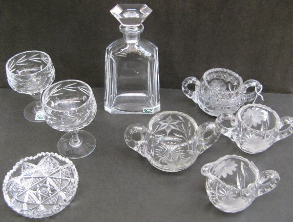 A GROUP OF EIGHT CUT CRYSTAL TABLE ACCESSORIES. I: A GROUP OF EIGHT CUT CRYSTAL TABLE ACCESSORIES. Including an Orrefors brandy decanter, with cut stopper, 8-3/4 in. ht.; cream and sugar set, engraved floral design; two double-handled sugar bowls; tog
