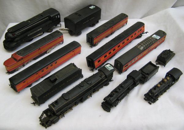 COLLECTION OF TRAINS: Lionel O gauge diesel locom: COLLECTION OF TRAINS: Lionel O gauge diesel locomotive #1688 with tender; New One Model Japan HO gauge steam locomotive and tender; #383832 HO gauge steam locomotive and tender marked Pennsylvania; HO