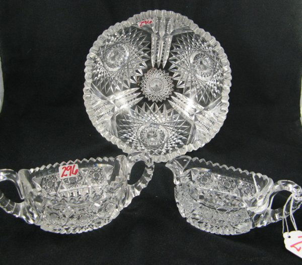 THREE AMERICAN CUT CRYSTAL TABLE ACCESSORIES. One: THREE AMERICAN CUT CRYSTAL TABLE ACCESSORIES. One a berry bowl, large hobstar and fan pattern, 8 in. dia.; together with a cream and sugar set, oblong-shape in hobstar pattern. C. 1900.