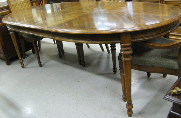 MODERN DINING TABLE AND CHAIR SET, Drexel Her: MODERN DINING TABLE AND CHAIR SET, Drexel Heritage Furnishings, Drexel, North Carolina, c. 1970's, the set comprising oval extension dining table with two leaves and six caned-back chairs. Table dimen