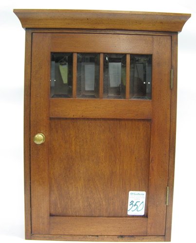 A MEDICINE OR SPICE WOOD WALL CABINET, having a b