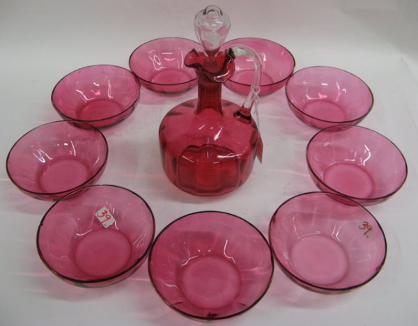 TEN CRANBERRY GLASS ITEMS. One is a cordial decant