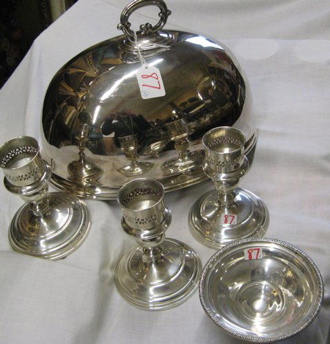 FOUR STERLING SILVER TABLE ACCESSORIES AND A SILVE: FOUR STERLING SILVER TABLE ACCESSORIES AND A SILVER PLATED ROAST COVER. The Sterling: 3 matching candleholders 5-1/4 in. ht., and a pedestal candy dish, 4-3/4 in. dia. The roast cover 12-1/2 in. dia.
