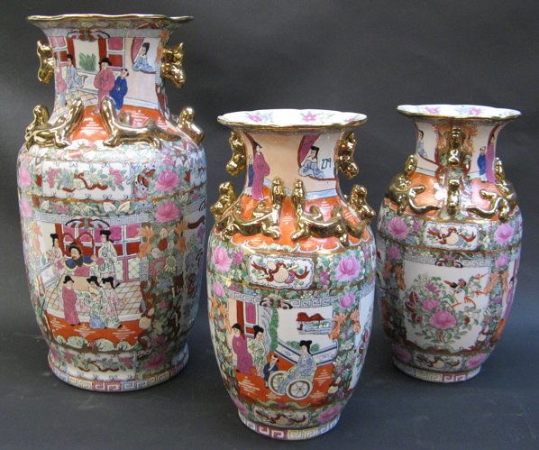 THREE CHINESE PORCELAIN GLAZED VASES, a large flo: THREE CHINESE PORCELAIN GLAZED VASES, a large floor vase and pair vases, hand enameled with primarily rose pink colors having scenes of Mandarin people, alternating with floral and bird decorations. A