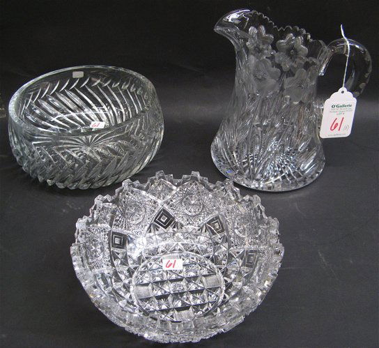 A GROUP OF THREE CUT GLASS TABLE ACCESSORIES. Two a: A GROUP OF THREE CUT GLASS TABLE ACCESSORIES. Two are American brilliant cut, including a bowl attributed to Libbey, heavily cut hobstar pattern with notched rim, 8 in. dia.; a cut and engraved floral