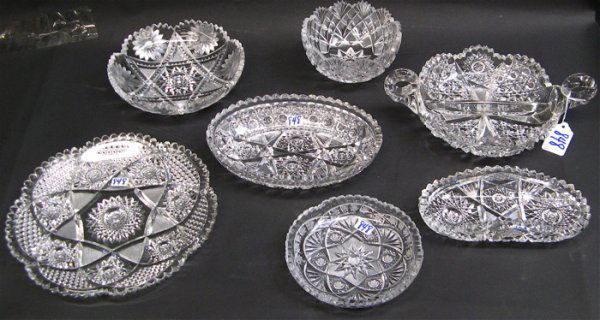 SEVEN CUT CRYSTAL TABLE ACCESSORIES: a round serv: SEVEN CUT CRYSTAL TABLE ACCESSORIES: a round serving platter, 9 in. dia.; an oval dish, 8 in. L.; a round dish, 7 in. dia.; a double handled divided nut or candy dish, 10-1/4 in. L.; a round candy dis
