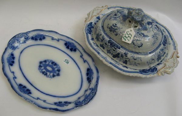 TWO ENGLISH BLUE AND WHITE TABLE ACCESSORIES, an o: TWO ENGLISH BLUE AND WHITE TABLE ACCESSORIES, an oval covered vegetable bowl, having blue floral on white ground pattern, gold accented. Length 15" by 12"; together with an oval platter, clover design