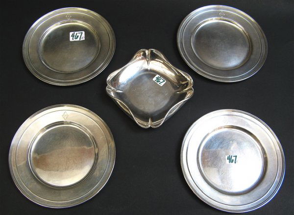 FIVE AMERICAN STERLING SILVER TABLE ACCESSORIES: 4: FIVE AMERICAN STERLING SILVER TABLE ACCESSORIES: 4 small chargers, 6-1/4" D.,one marked Gorham, three marked underfoot with the Whiting Manufacturing Co. trademark, Sterling; together with a square fo