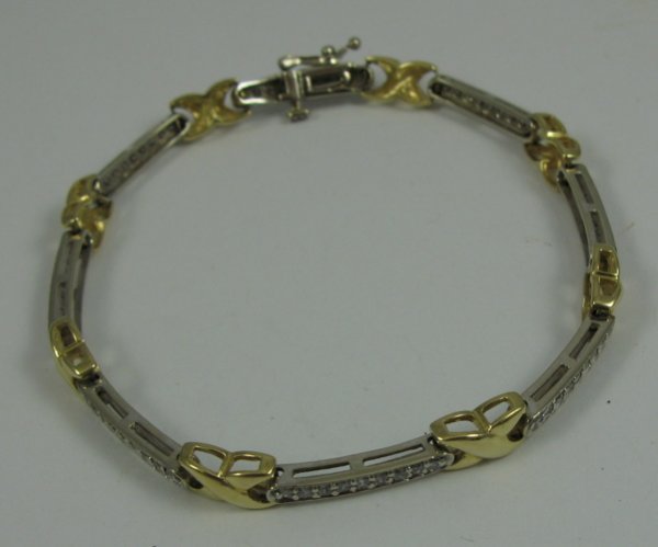 DIAMOND AND 10K YELLOW AND WHITE GOLD BRACELET, 7
