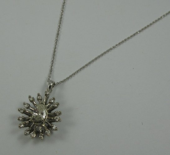 DIAMOND AND 14K WHITE GOLD PENDANT NECKLACE. The p
