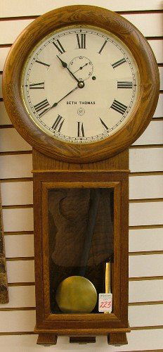SETH THOMAS ONE-WEIGHT REGULATOR WALL CLOCK, Seth: SETH THOMAS ONE-WEIGHT REGULATOR WALL CLOCK, Seth Thomas Clock Co., Thomaston, Connecticut, 20th century, no. 1596 of 4000 limited editions, round/long-drop oak case with 12" round dial; complete with