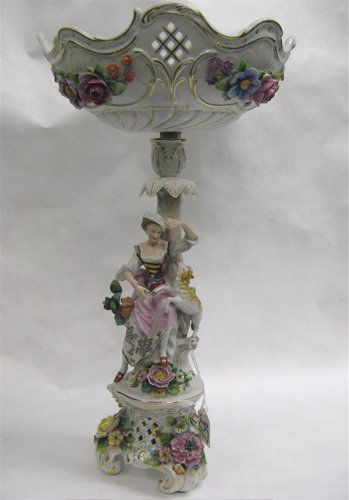 GERMAN PORCELAIN FIGURAL FRUIT BOWL, having a han: GERMAN PORCELAIN FIGURAL FRUIT BOWL, having a hand painted female with a lamb, applied flowers and floral decorated bowl, newer mark underfoot, 19-1/4" H.; bowl, 10-3/4" D.