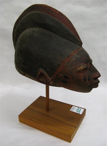 A HAND CARVED WOODEN AFRICAN HELMET attributed to  - 2
