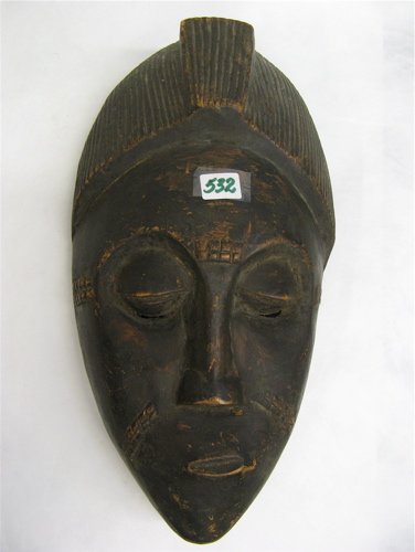 A BOULE TRIBAL FACE MASK of hand carved native wo