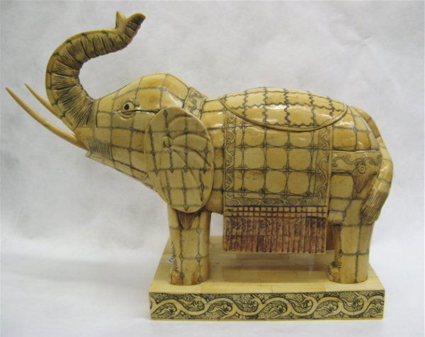 CHINESE FIGURAL BONE ELEPHANT, wood construction e: CHINESE FIGURAL BONE ELEPHANT, wood construction encased in bone tiles, with etched features and decoration, in ceremonial costume, on rectangular pedestal base. Height 14-1/4".