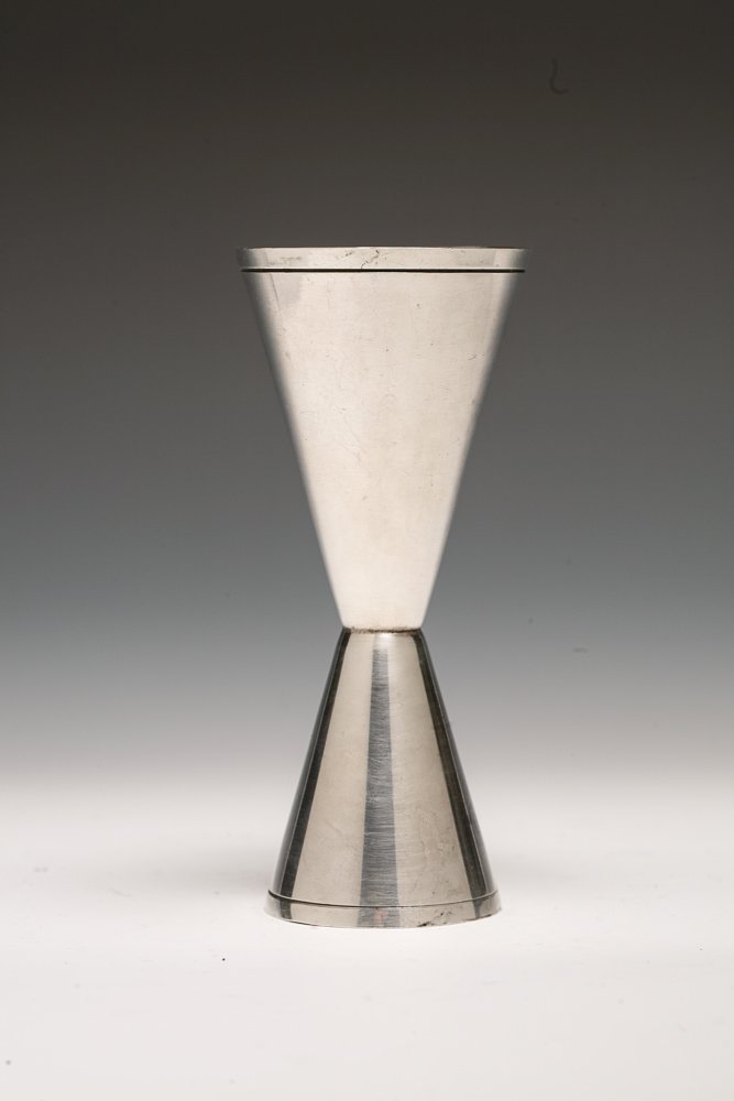 TIFFANY & CO. STERLING SILVER JIGGER-DOUBLE SHOT: Tiffany sterling silver double shot / jigger. One end is a single shot and opposite end is a double shot. The Tiffany mark is on the rim of the smaller end reads: TIFFANY & CO. MAKERS STERLING.