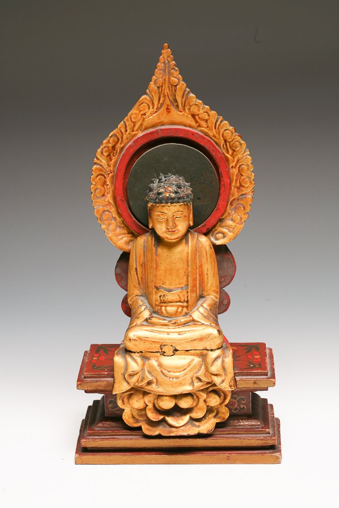 Japanese Giltwood Figure Amida Buddha: A Japanese Meiji/Taisho Era carved Gilt Wood Amida Buddha seated figure. The black halo disc behind the buddha's head is a round piece of slate tied with a string through the wood.