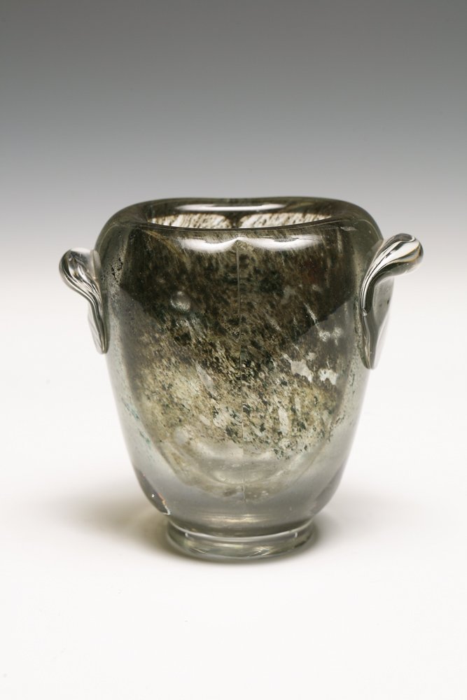 Henri Navarre (1885-1971) Glass Vase: A glass vase, circa 1930, having an oval shaped vessel in heavy thick-walled glass, internally decorated in the style of moss agate, with applied clear glass handles and circular clear foot. Signed un