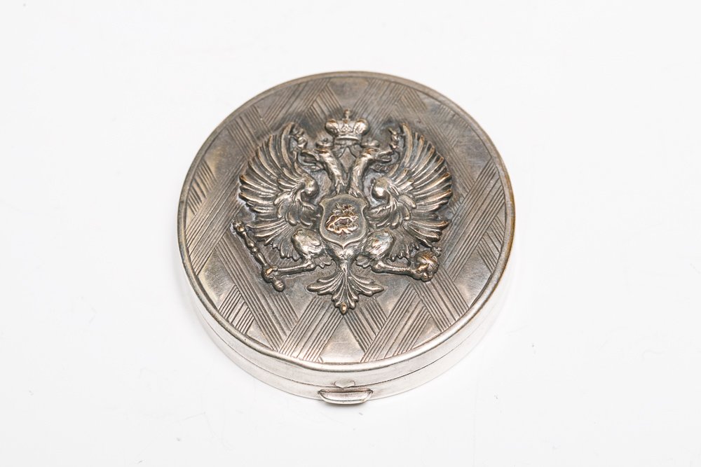 French Compact with Imperial Russian Eagle: A 1920s French cosmetic case made in Paris by Coty for Russians living in exile in France. Original paper label inside, but no powder.Weight: 45 gramsDimensions: 2" diameter x .5" height