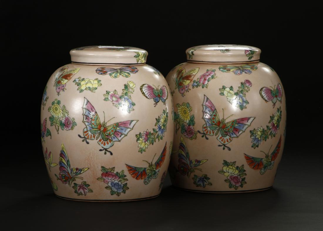 Pair of Peach Ground Famille Rose Ginger Jars: With lids. The base with Iron-red four character Qianlong reign mark. Provenance: Christie's July 31, 2007 House Sale, Lot 264. Height 10 in.