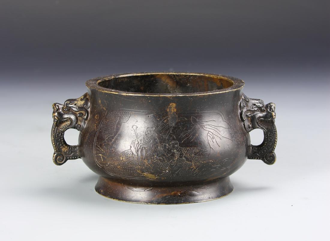 Chinese Bronze Censer: 19th C., bulbous body on a raised base with flared rim, two attached loop handles in the form of dragon heads, body incised with illustration of figures in a landscape, mark on base. Height 7 in., Wid