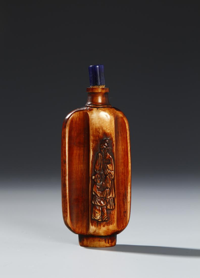 Chinese Carved Snuff Bottle: Carved Bone Snuff Bottle, of brown tune. Height 3 1/2 in.