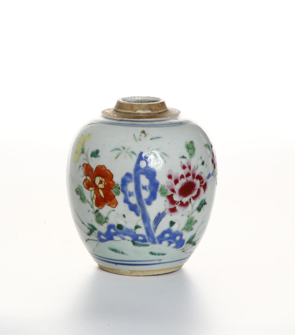 Chinese Famille Rose Butterfly Ginger Jar: 18th C., the ovoid jar tapering to the foot, with low lip, the body painted with floral sprays. Height 5 in.