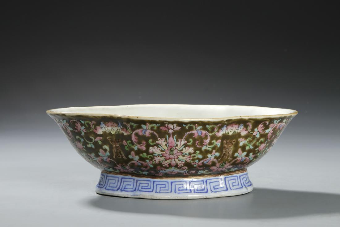 Chinese Famille Verte Lobed Bowl: Decorated with floral scrolls above a keyfret band all reserved on a black glaze, the base with six-character seal mark. 2 3/4 in., 8 3/4 in., 6 1/4 in.