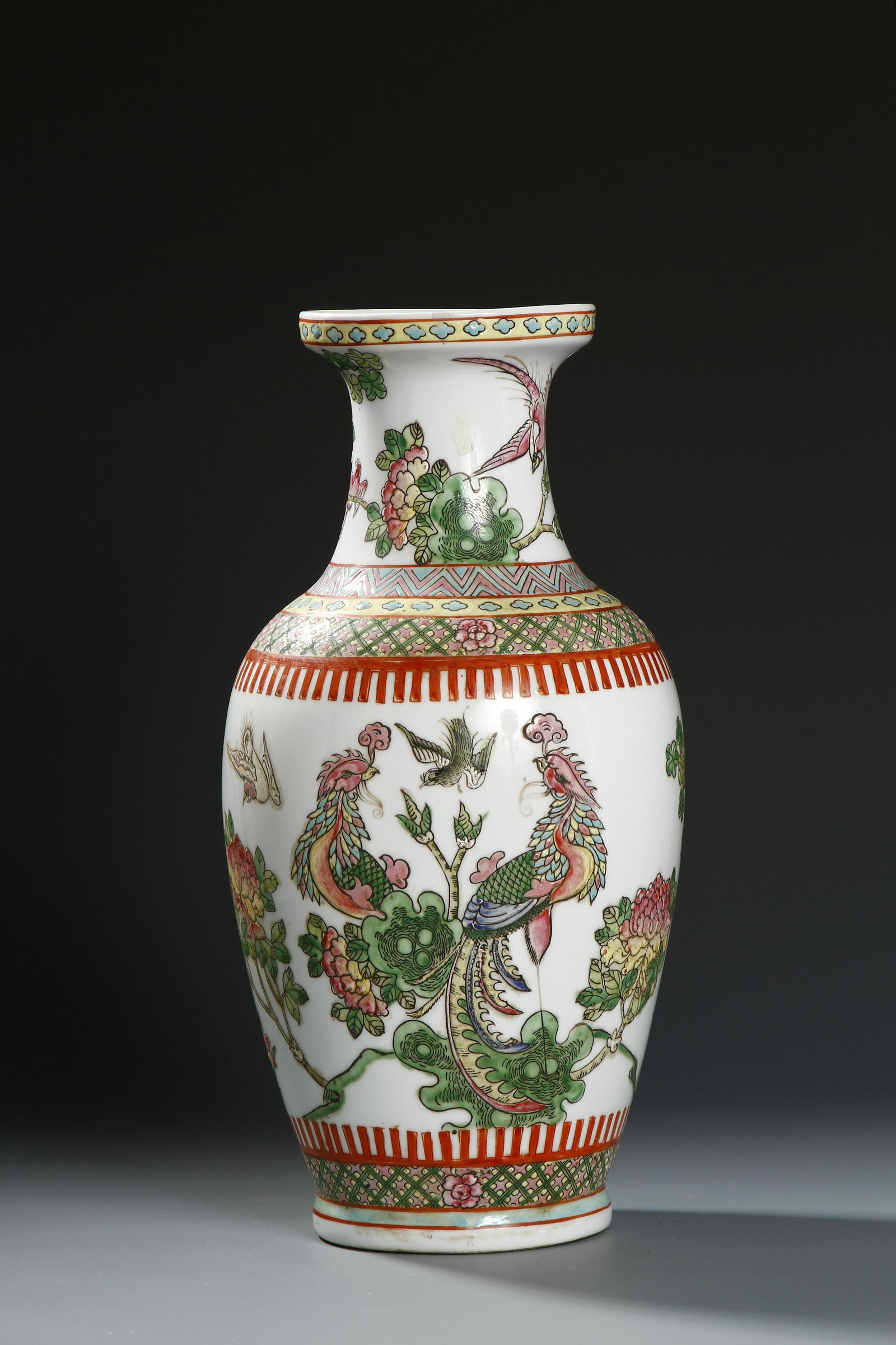 Chinese Famille Rose Rouleau Vase: Republican period, set on a waisted foot, the body brightly painted with two phoenix resting on floral sprays surrounded by blossoms and birds, the base with six-character Tongzhi mark. Height 14 in.