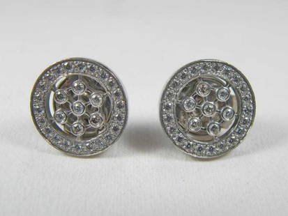 Tiffany & Co platinum & diamonds earings: Tiffany & Co platinum & diamonds earings. 7/16 in diameter. Weight: 4.3 grams