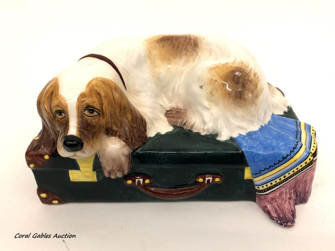 RARE A. ZEN NOVE FOR TIFFANY PORCELAIN DOG STATUE: Rare vintage porcelain sculpture by Antonia Zen Nove - Italia, made exclusively for Tiffany & Co. Modeled in the form of a Spaniel lying atop a large suitcase, with hand-painted decoration and glazed 