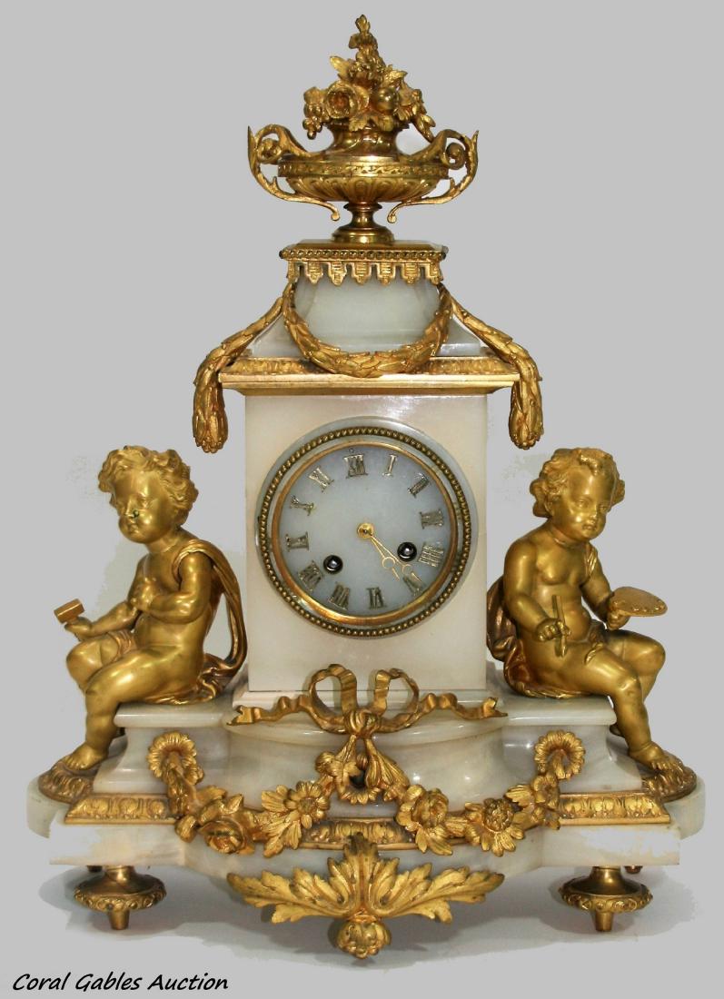 ANTIQUE JAPY FRERES ORMOLU MOUNTED ALABASTER CLOCK: Antique French Du Moulin Nouef & H. Nolle Paris Japy Freres figural cherub ormolu bronze mounted mantel clock completed with white alabaster case. Has a Japy Freres movement number 1 400 6 9. Movement