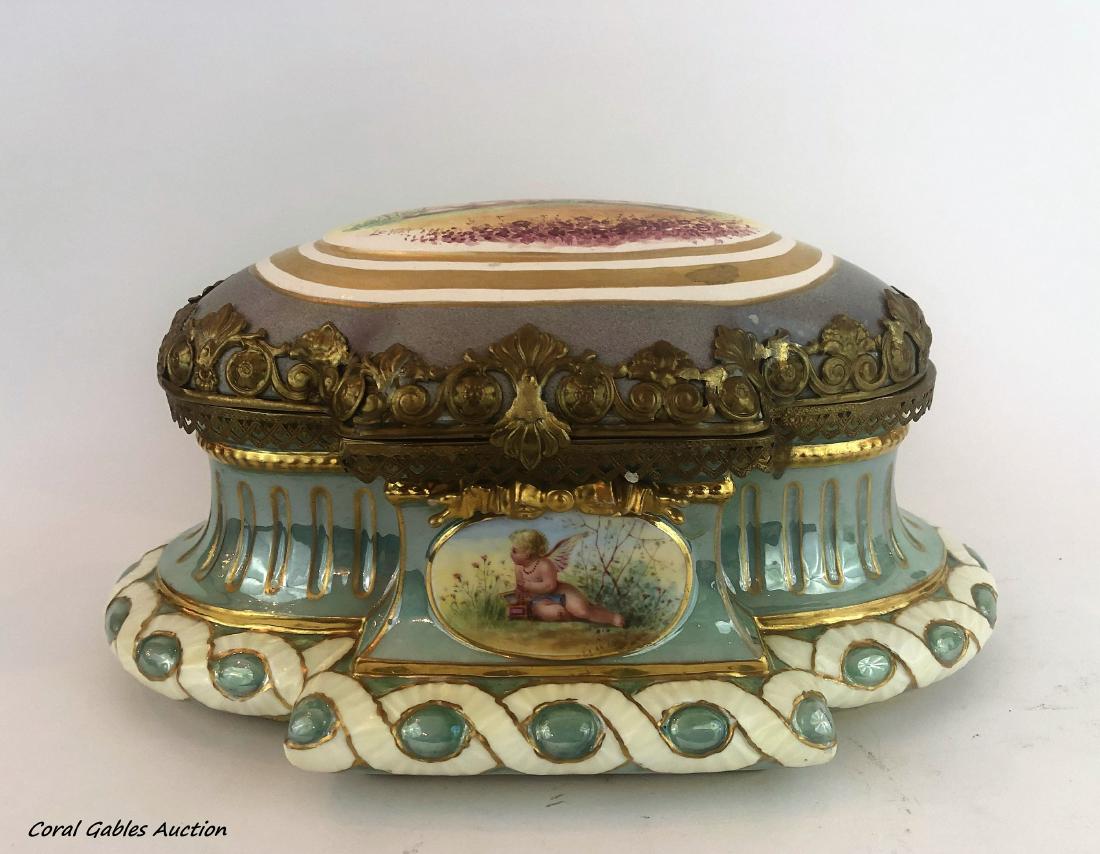 Antique porcelain sevre and bronze box signed Leviet: Antique porcelain sevre and bronze box signed Leviet. Measure 6"in H x 12"in W.