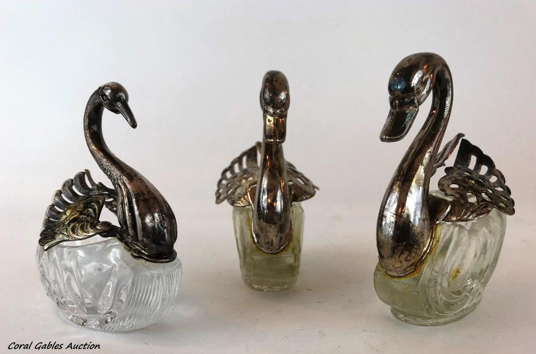 Three pieces of Baccarat style serving: Three serving pieces Baccarat style with swan designs. Measure 3"in H x 3"in W.