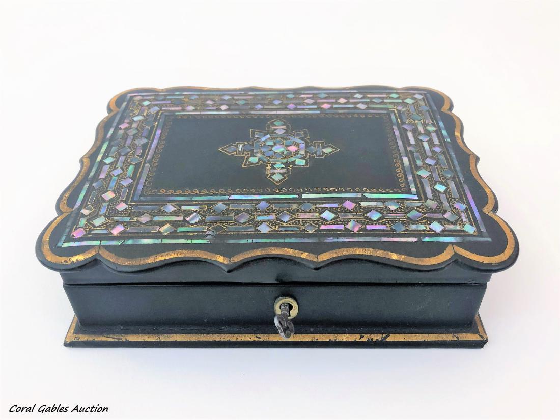 Antique wooden box and mother of pearl: Antique wooden box and mother of pearl. Measure 2"in H x 7"in W.