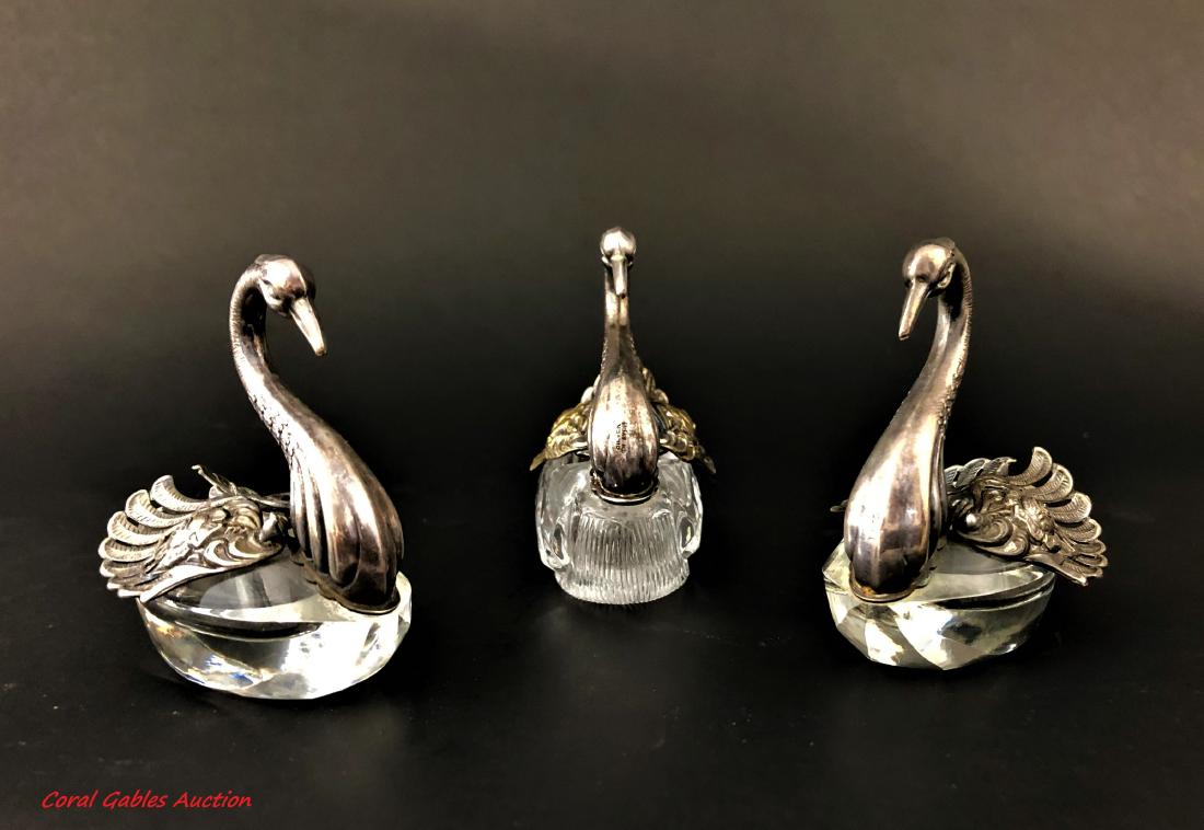 Three pieces of Baccarat style serving: Three serving pieces Baccarat style with swan designs. Measure 3"in H x 3"in W.