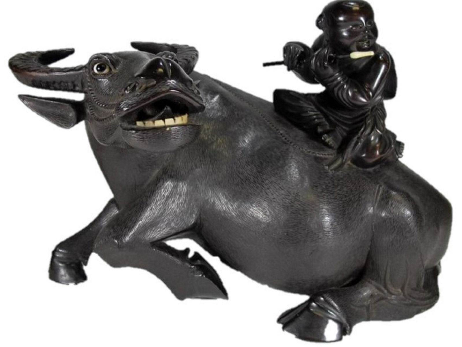 Probably carved ebony with glass eyes bull sculpture: Probably carved ebony with glass eyes bull sculpture. 9 3/4 in H x 14 in W x 7 1/2 in D.Â