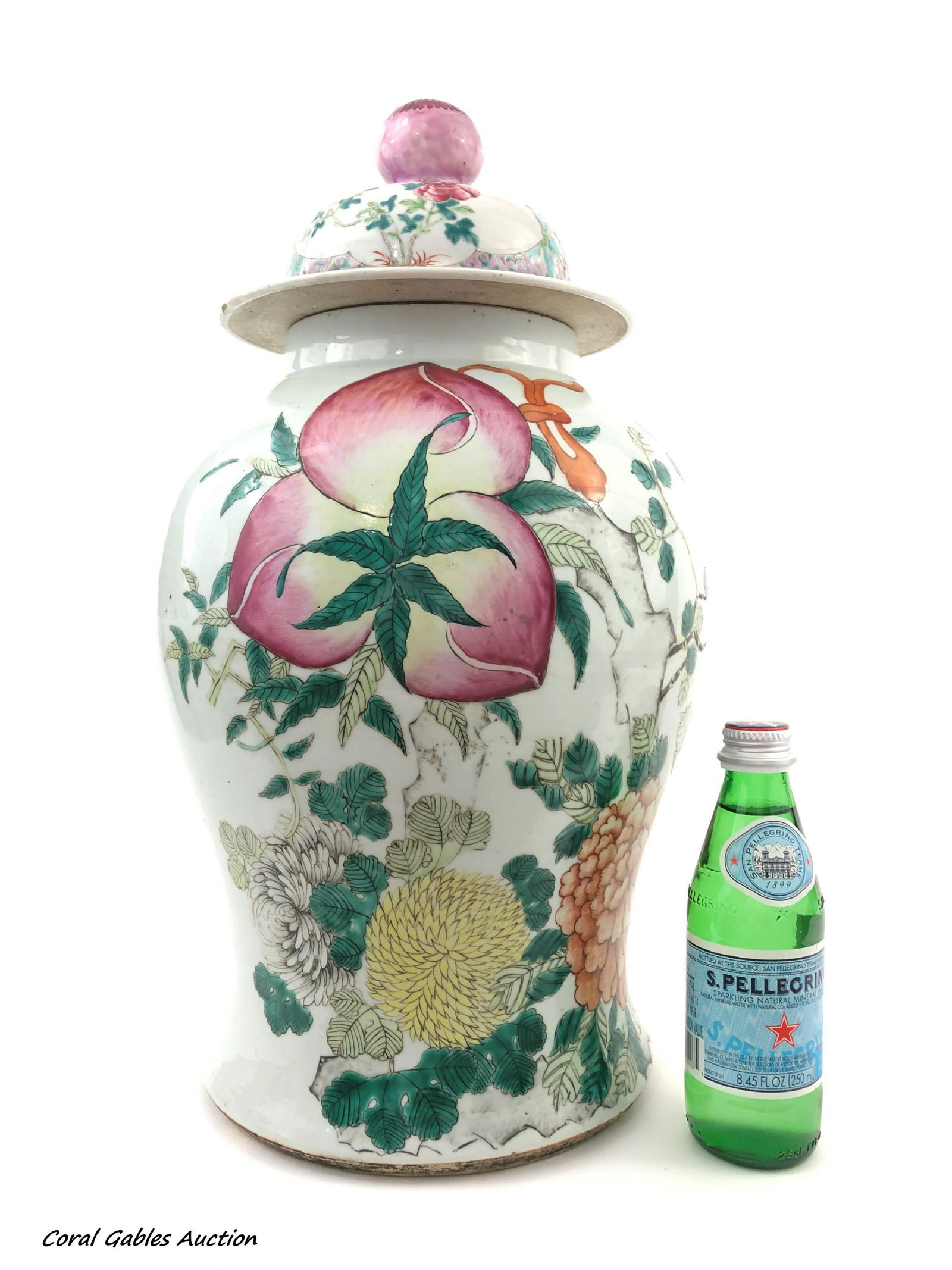 Posibly 19 century Famille Rose Peach Ginger Jar: Posibly 19 century Famille Rose Peach Ginger Jar. Large ginger jar with ripe peaches and flowers on the body. A peach finial tops the lid decorated with flowers. Calligraphy is on the back. Drilled th