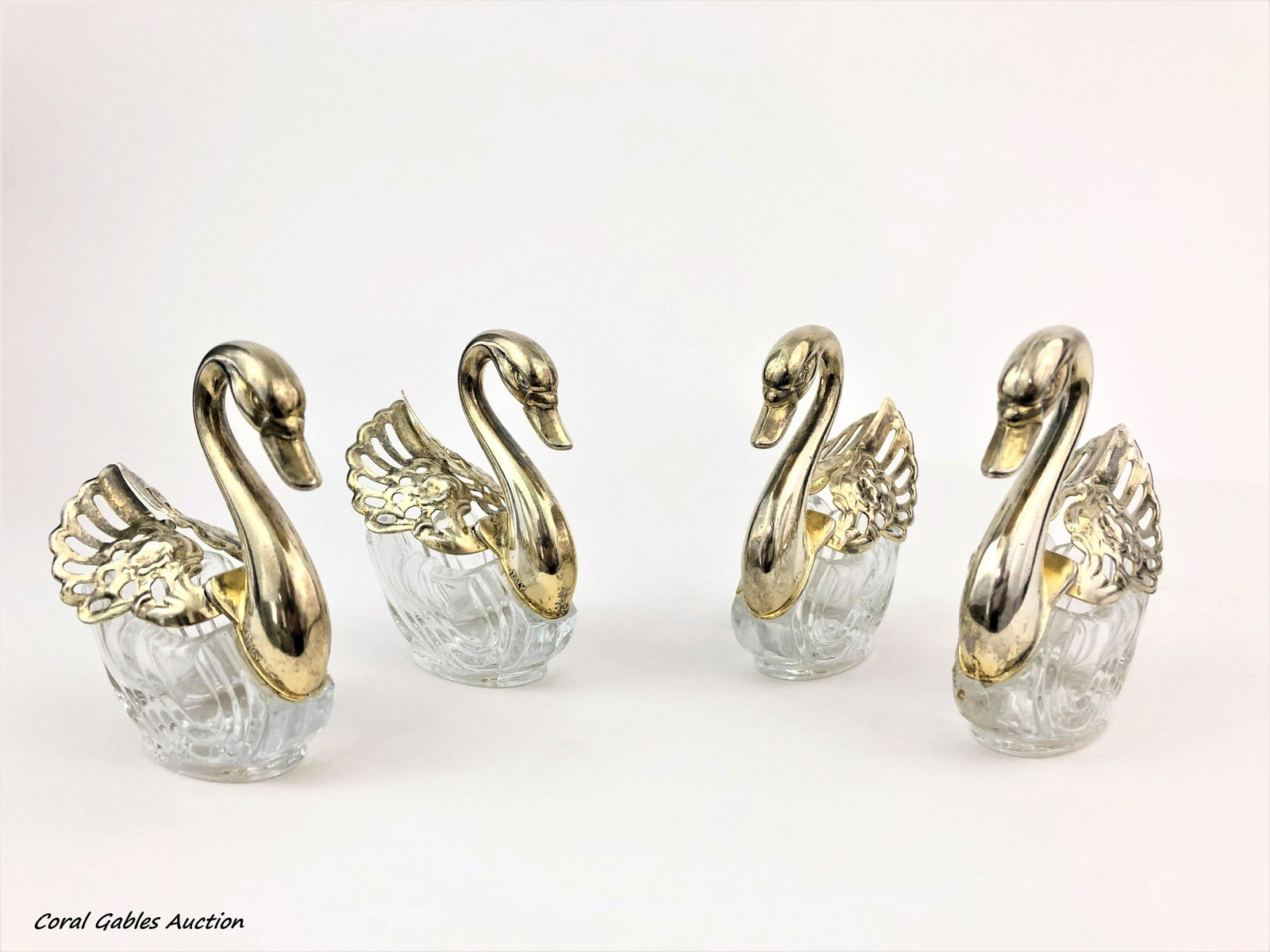 Four Serving pieces of Baccarat style: Four Serving pieces of Baccarat style with swan designs. Measure 3"in H.