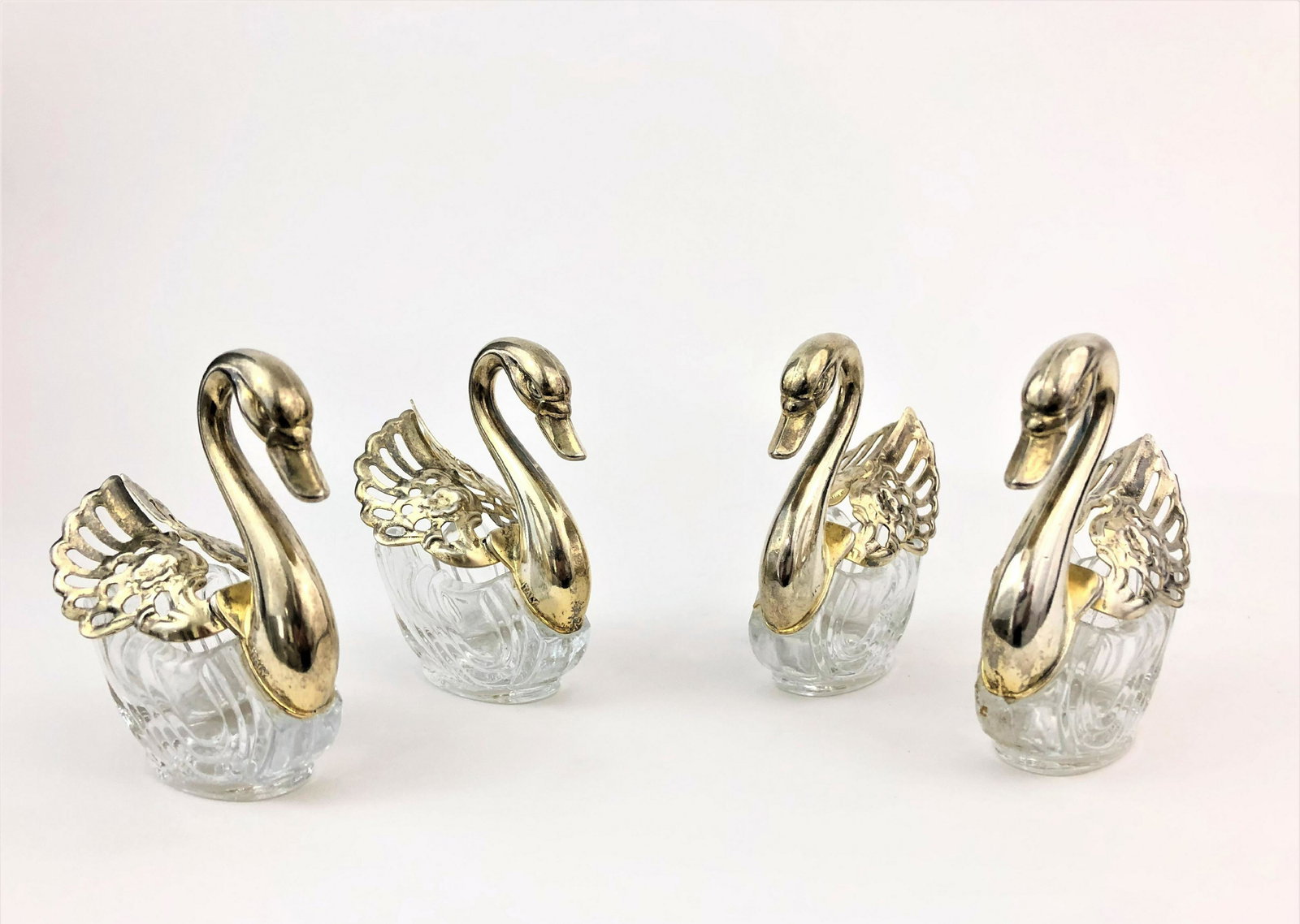 Four Serving pieces of Baccarat style: Four Serving pieces of Baccarat style with swan designs. Measure 3"in H.