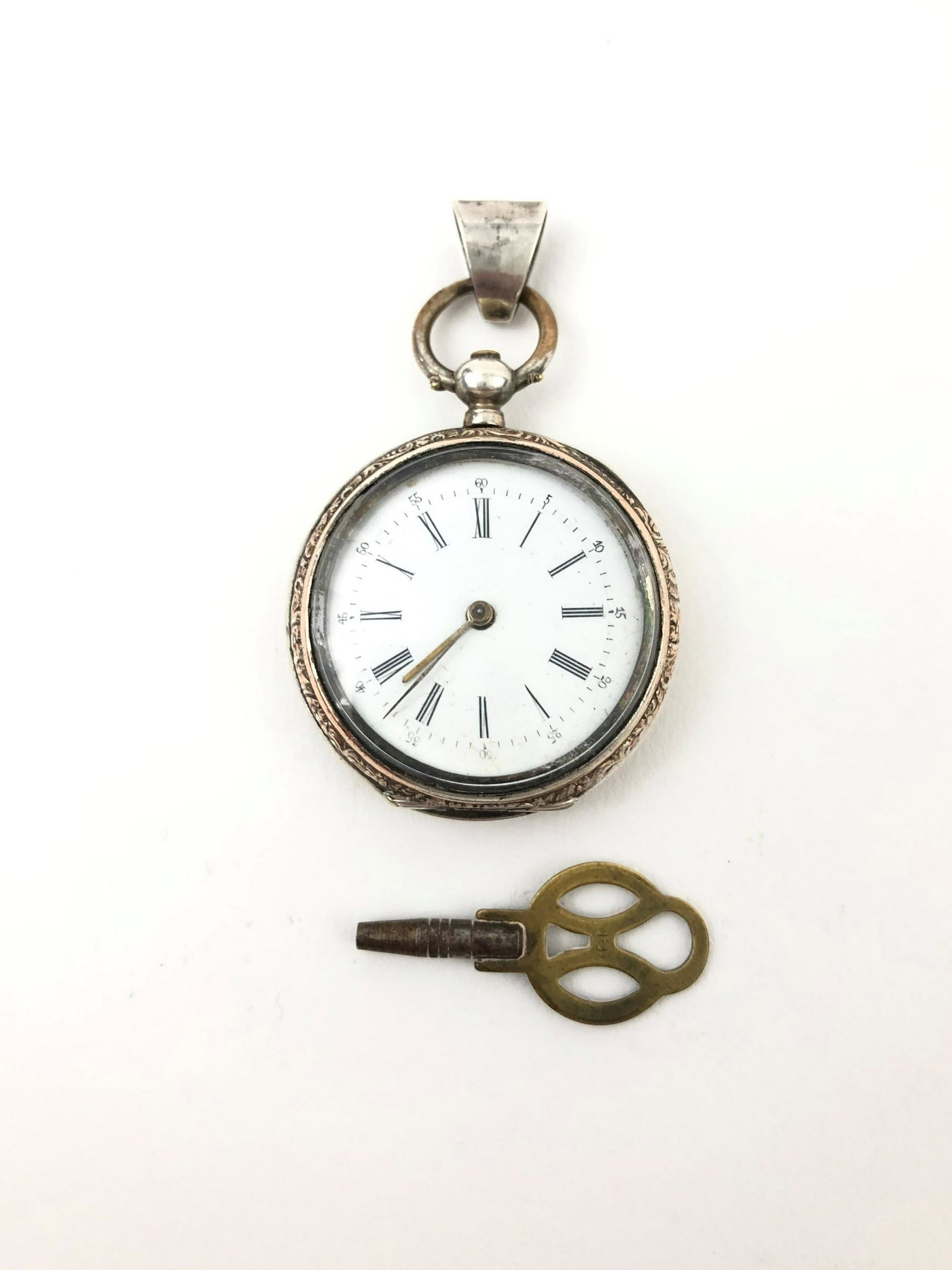 800 Sterling Silver Pocket Watch: 800 Sterling Silver Pocket Watch. Measure 1 1/2"in x 1 1/4"in diameter.