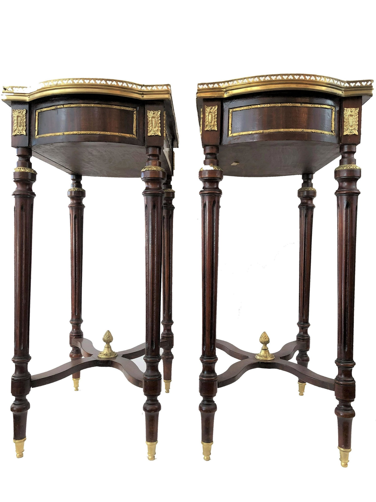 Pair of wooden tables with marquetry: Pair of wooden tables with marquetry and bronze designs. Measure 28"in H x 19 1/2"in W x 13"in D.