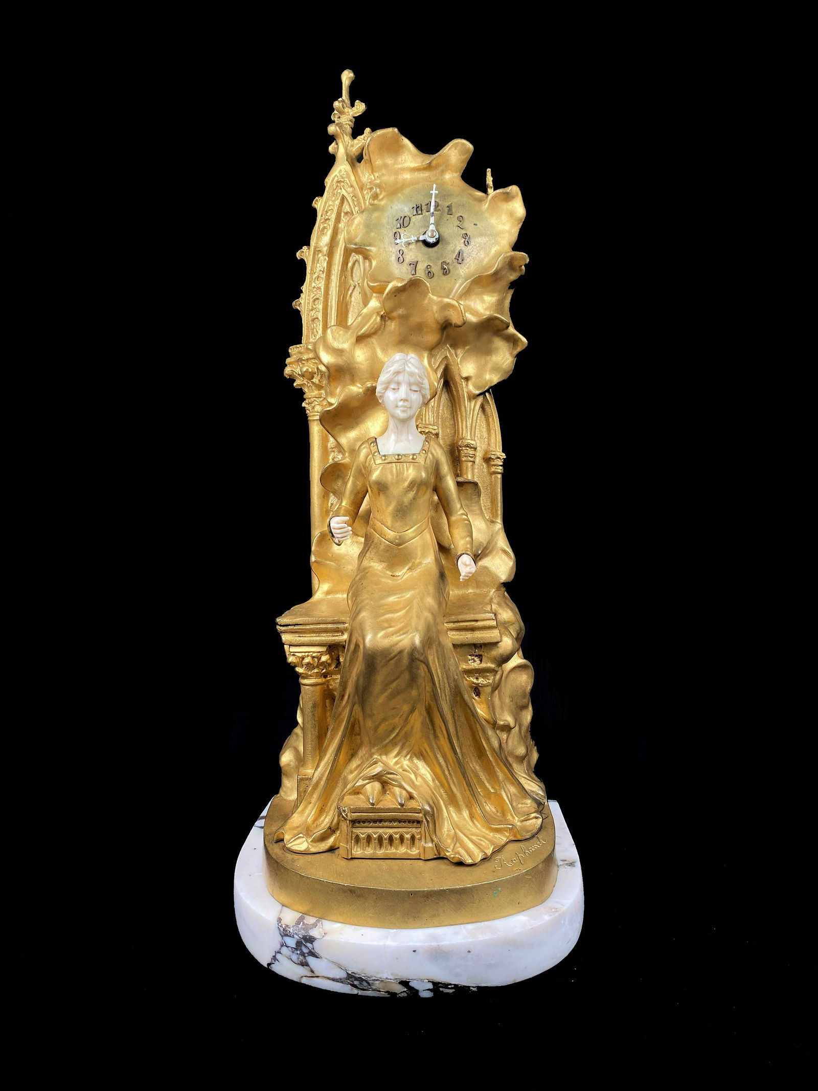 Xavier Raphanel (1876-1957) French: Xavier Raphanel (1876-1957) French. Bronze Sculpture and Clock. Measure 21"in H x 8 1/4"in W. The clock has a key, it's old but we don't know if it works.