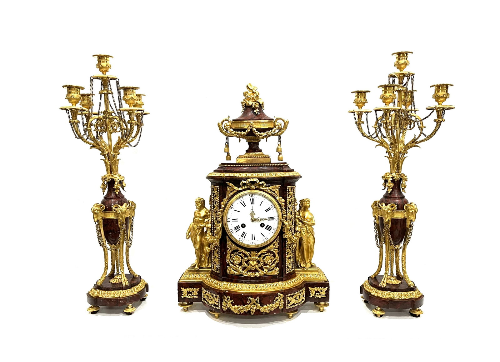 19th Century French Louis XV Style Marble & Gilt Garniture Clock Set: 19th Century French Louis XV Style Marble & Gilt Garniture Clock Set Antique French red marble mantel clock and garnitures. The clock features parcel gilt bronze semi nude classical figures of a man a