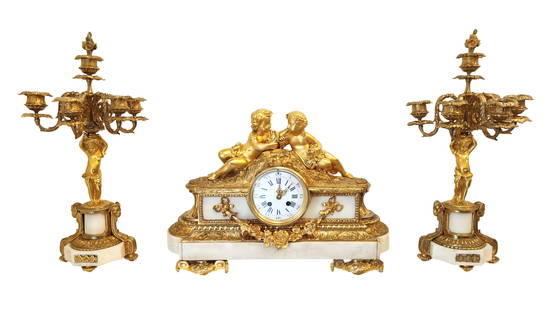 Antique French Louis XVI Style Gilt Bronze and Marble Clock Set Jean-Jacques Feuchere: Antique French Louis XVI Style Gilt Bronze and Marble Clock Set Signed Jean-Jacques Feuchere (1807 - 1852) Clock Measure 13 1/2"in H x 19"in W x 8"in D Candelabras 19 1/2"in H x 6 3/4"in W x 5"in D <
