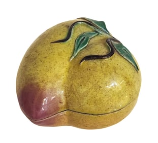 Delicate decorative box made of glazed ceramic, finely modeled in the shape of a peach—an enduring