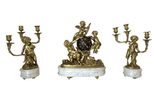 Antique 19th Century French Ormolu Gilt Bronze Matel Clock Garniture Set: Antique 19th Century French Ormolu Gilt Bronze Matel Clock Garniture Set Clock Measure 16 1/2"in H x 14"in W x 5 1/2"in D Candelabras Measure 15 1/2"in H x 5"in Diameter