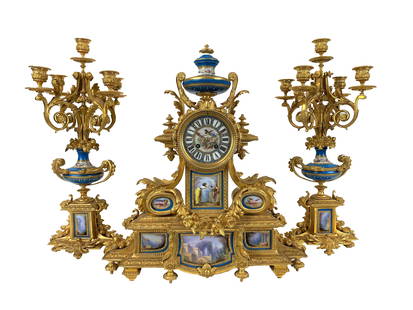 Louis XVI Sevres Porcelain Mounted Clock Garniture: Louis XVI Sevres Porcelain Mounted Clock Garniture Circular Porcelain dial with Roman hours on a blue ground Clock Measure 19 3/4"in H x 17 1/2"in W x 5 3/4"in D Cand
