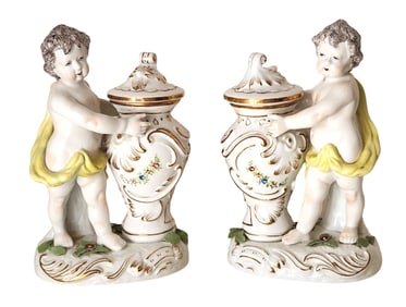 Pair of Chelsea Style Porcelain Cherub Figural Urns with Removable Lids