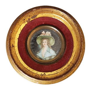 Antique French Hand-Painted Miniature Portrait in Giltwood Frame: Finely detailed antique French miniature portrait painting of a lady in 18th-century dress, wearing a large green hat with pink bow. The portrait is executed on a circular panel, set into a round velv